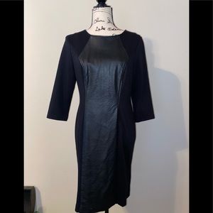 black dress with a figured insert "leather look"
